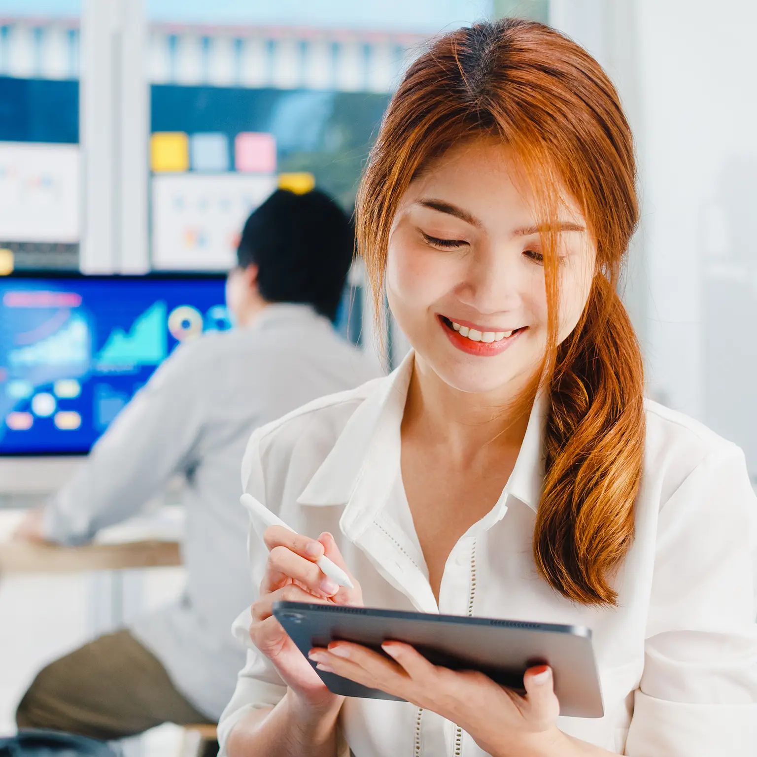 lady using digital tablet talk to colleagues about plan in video call while smart working from modern office software Information technology.